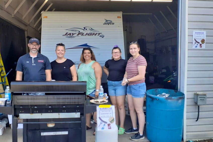 Stone's RV recently held a BBQ to raise money for Stone's RV employee Jolene MacLeod. Pictured during the event are Greg Park (left), Ashley Spaulding, Alecia Sutherland, Ashley's daughter Kendell Spaulding, and Patricia Levy.