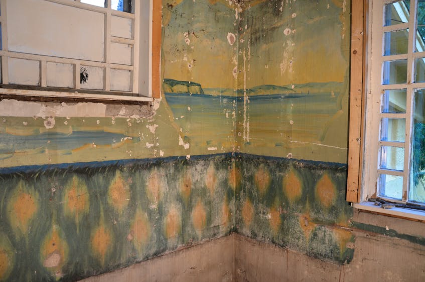 As work progressed to investigate the extent of the damages at Concrete House, a wall mural painted by Charles Macdonald in what was once his bathroom was uncovered. It features Cape Blomidon, ducks and other imagery. The room once featured a concrete bathtub. KIRK STARRATT