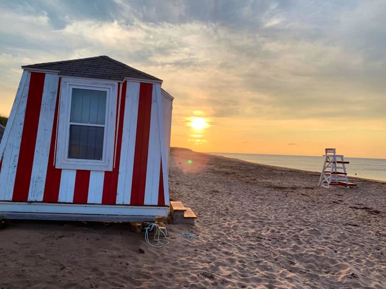 The many footprints in the sand tell the story of a busy day at the beach!  Anne Boswall watched as the sun lowered in the western sky. Stanhope Prince Edward Island National Park is home to numerous stunning summer sunsets and a refreshing breeze off the Gulf of St. Lawrence.