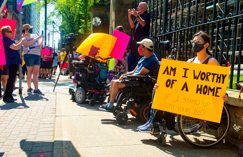 April Hubbard holds a sign as she attends a Disability Rights Coalition rally outside Province House on Friday, Aug. 13, 2021.
Ryan Taplin - The Chronicle Herald - Ryan Taplin