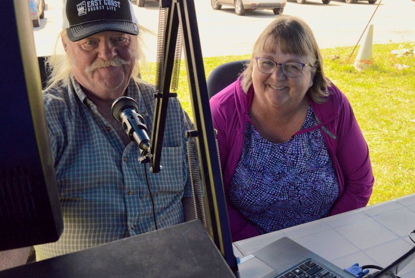 Amateur radio operator Darrell MacArthur, left, shows friend Selina Trainor how to make contact on the air at a demonstration in Summerside Aug. 8.
