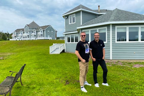 Interior design pros Colin McAllister and Justin Ryan, known for TV shows like Home Heist and Cabin Pressure, stand in front of their newest renovation project, Point of View Suites. The Louisbourg hotel will relaunch in 2022 under its new moniker, North Star. The property is made up of about 22 bedrooms, a beach house, staff quarters, two restaurants, a stage for entertaining, as well as five acres of ocean-facing grounds and a private beach. 