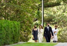 Prime Minister Justin Trudeau walks to Rideau Hall in Ottawa with his family on Sunday to ask Gov. Gen. Mary Simon to dissolve Parliament. Trudeau called a federal election for Sept. 20.
