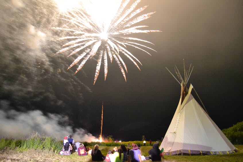 A crowd gathers to watch the fireworks Saturday night as part of the Eskasoni powwow. ARDELLE REYNOLDS/CAPE BRETON POST - Ardelle Reynolds