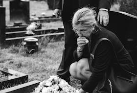 A death doula helps people process their grief and teach them what to expect when a loved one dies. -123RF