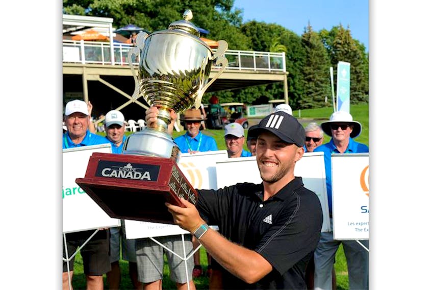 Blair Bursey lifts the champion's trophy after winning the 2021 SMD Canada Cup Sunday in Victoriaville, Que. — SMD Canada Cup/Facebook
