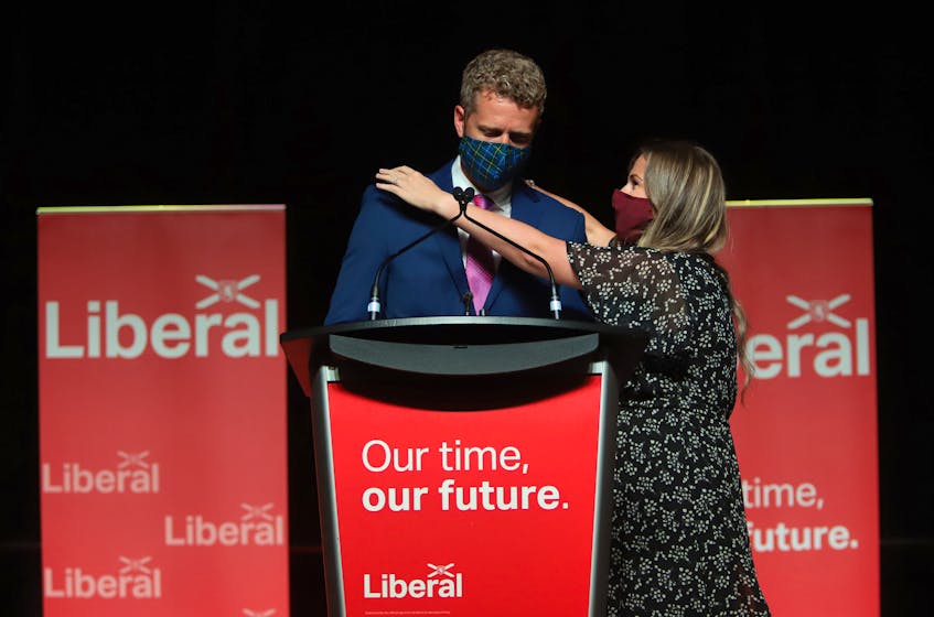 Nova Scotia Liberal Leader Iain Rankin is hugged by his wife, Mary Chisholm, after he gave his concession speech at Liberal HQ on election night in Halifax Tuesday, Aug. 17, 2021, following the Liberal party's defeat at the hands of the Progressive Conservatives. - Tim Krochak.