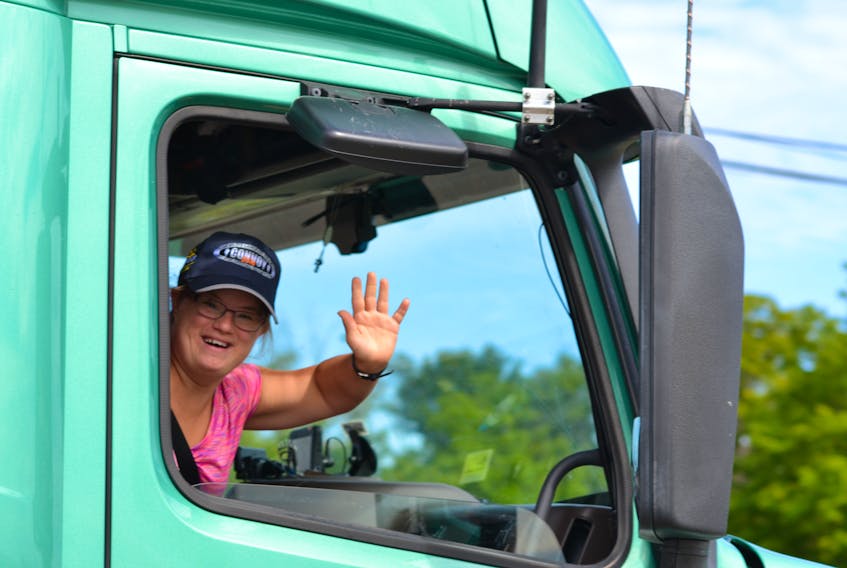 Special Olympics P.E.I. athlete, Amber Metcalfe, participates in a previous Truck Convoy event.