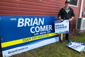 Cape Breton East MLA Brian Comer stands near some signs being put away this morning at the Howie Centre Fire Hall which was used as his election headquarters during the 2021 campaign. NICOLE SULLIVAN/CAPE BRETON POST 
