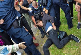 A protester is dragged away by police, a shelter removal turned into a major confrontation with Halifax regional police in Halifax Wednesday August 18, 2021.

TIM KROCHAK PHOTO