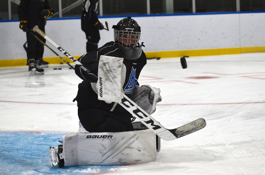 Cape Breton Eagles goaltending prospect Rémi Delafontaine makes a block save during opening day of the club’s rookie camp at Miners Forum in Glace Bay. The 17-year-old was traded to the Eagles from the Chicoutimi Saguenéens on Jan. 25. JEREMY FRASER/CAPE BRETON POST. - Jeremy  Fraser