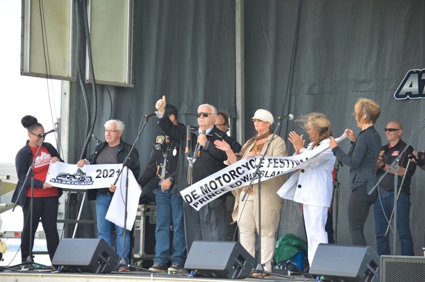 Summerside Mayor Basil Stewart cuts the ribbon on Saturday to mark the official opening of the 2021 Atlanticade Motorcycle Festival. - Kyle Reid