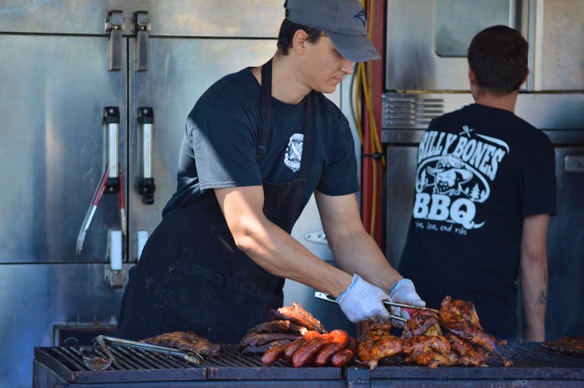 Daniel Kapuscinski was hard at work barbecuing Saturday, dishing out some delicious grilled food as part of Ribfest held alongside Atlanticade. - Kyle Reid