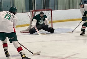 Goalie Mathis Rousseau positions himself to make a stop against Jake Freelove at Halifax Mooseheads training camp at the RBC Centre in Dartmouth on Friday. - Willy Palov
