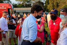 Justin Trudeau mingles with supporters at a campaign stop for Heath MacDonald's Malpeque campaign in the 2021 federal election. MacDonald can be seen on the left.