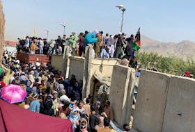 A still image taken from video shows crowds of people near the airport in Kabul, on Aug. 23. ASVAKA NEWS via REUTERS
