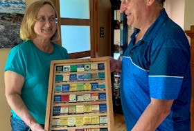 Cathy Mulley and Ian Cunningham are proud of their shadow boxed collection of Cape Breton matchbooks. CONTRIBUTED