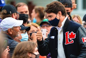 Prime Minister Justin Trudeau greets supporters gathered in Quidi Vidi Village during a campaign stop in Newfoundland Monday evening.

Keith Gosse/The Telegram