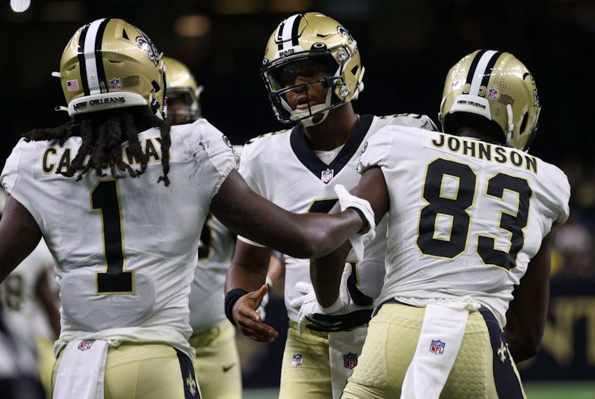 New Orleans Saints' Marquez Callaway (left) celebrates after a touchdown with Jameis Winston (centre) during Monday's game.