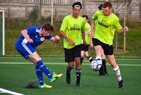Carter Brown of the New Waterford Wolves, right, blocks a shot from Nick Mahar of Whitney Pier Blue during Cape Breton and District Soccer League under-18 boys’ semifinal action at MacKinnon Memorial Field in New Waterford on Monday. New Waterford won the game 2-1. JEREMY FRASER/CAPE BRETON POST.