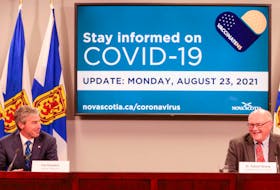 Nova Scotia Premier Tim Houston and Chief Medical Officer of Health Dr. Robert Strang are seen during Monday's COVID-19 briefing.