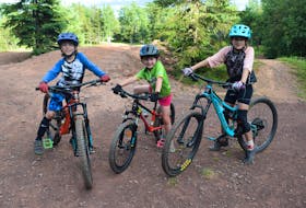 Max Simms, 7, Janelle Cumming, 5 and Peaka Simms, 9, have biked "since they were in diapers." They love hitting the hills and trying new skills.