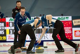 Nova Scotia skip Scott McDonald watches as Phil Crowell, left,  and Scott Saccary sweep a rock into the house against Ontario at the Tim Hortons Brier in Calgary this past March. The CBRM is putting in a bid for the 2023 Brier. Michael Burns / Curling Canada