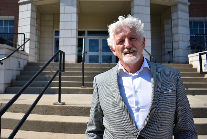 Holland College president Sandy MacDonald stands outside a building on the Charlottetown campus on Aug. 25. Earlier in the day, the college announced it would be mandating all students and staff to be fully vaccinated by Oct. 15.