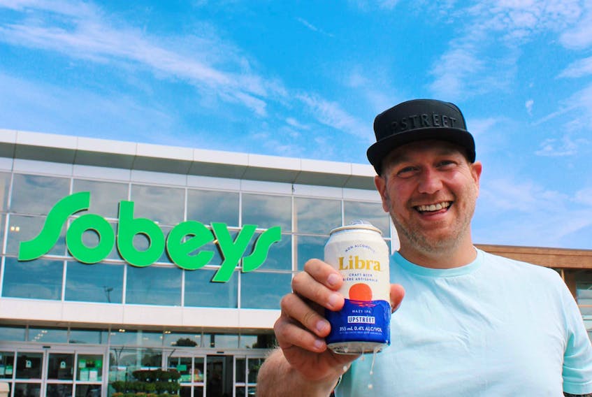 Mitch Cobb, co-founder of Upstreet Craft Brewing, celebrates the launch of Libra at all Sobeys stores in Atlantic Canada. (CNW Group)
