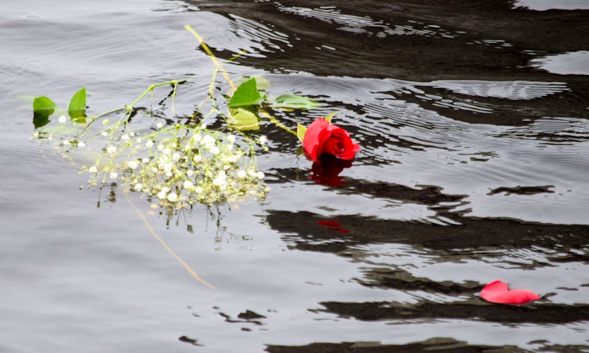 A rose floats out to sea in remembrance of victims of the slave trade. KATHY JOHNSON

 - Kathy Johnson