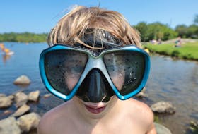 Linden Reitsma, 10, with his dad took to snorkelling at Albro Lake in Dartmouth to try to escape the heat and humidity Thursday afternoon. Many people took to their local beaches to cool down at a heat warning continues for the Maritimes. The front is supposed to move off Friday, with weekend temperatures returning to seasonal highs.