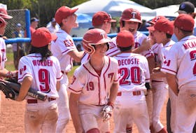 The Truro U13 AAA Bearcats meet Austin Brown at the plate following his dramatic sixth-inning home run in the semi-final game versus the Halifax Mets Sunday morning.