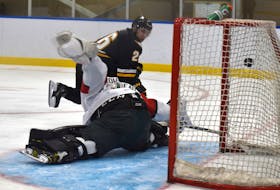 Nicolas Hogue of the Cape Breton Eagles, right, dekes out and beats Halifax Mooseheads goaltender Mathis Rousseau during Quebec Major Junior hockey League preseason action at Miners Forum in Glace Bay on Wednesday. Cape Breton won the game 2-1. JEREMY FRASER/CAPE BRETON POST