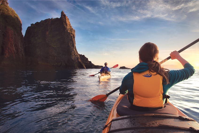 NovaShores Adventures offers daily sea kayak tours that explore the area’s geology and natural history, including the famous Three Sisters sea stacks. - Photo Courtesy Tourism Nova Scotia / Scott Munn.