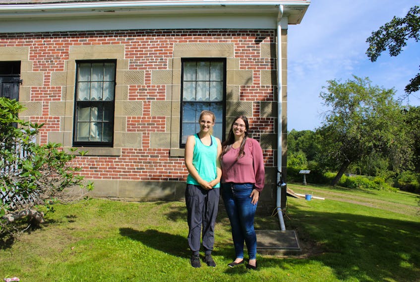 Shanae Thiessen (left) and Cyenna Link (right) are the two summer students who have been working on the escape room.