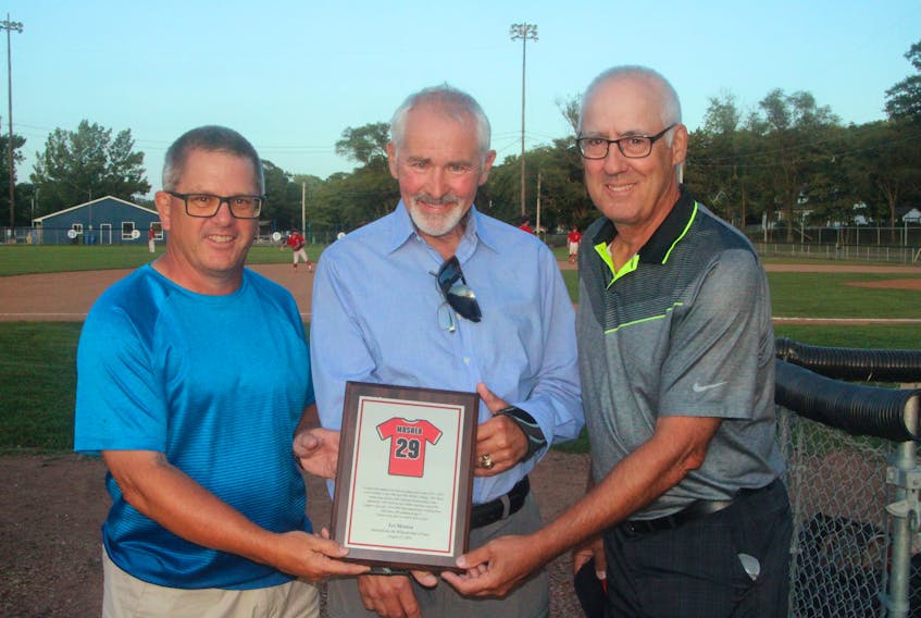 Ian Mosher, centre, was presented a plaque after he was inducted into the Kentville Wildcats Hall of Fame Aug. 17 at Memorial Park. His former teammates took part in the ceremony, including Barney Van Blarcom, left, and Bill Young. The ceremony was held prior to the Wildcats hosting the Dartmouth Moosehead Dry in Nova Scotia Senior Baseball League action. The Wildcats won the game 6-5 on Colby Turple’s two-out single in the bottom of the eighth inning. Kentville erased a five-run deficit to capture the victory and improved to 7-9 on the season. Caleb Medicraft picked up the win after throwing six scoreless innings of relief.