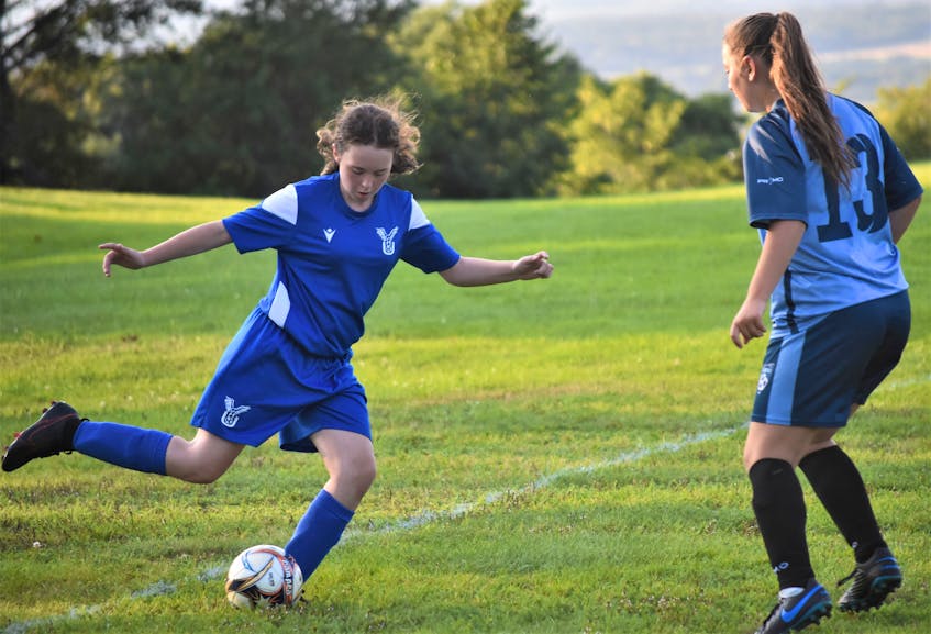 Sophie Hatchard is about to play a cross during the North Nova United Soccer Club (NNUSC) U-13 girls soccer team’s game versus the CC Riders, Sunday evening in Truro. - Richard MacKenzie
