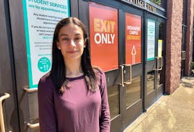 Cape Breton University Students' Union President Madlyn O'Brien stands outside the one of the school's entrances on Thursday, less than two weeks before the CBU opens for in person classes — part of level four of the university's Return to Campus plan. NICOLE SULLIVAN/CAPE BRETON POST 
