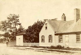 A.C. Dodd’s residence on the corner of Dorchester Street and the Esplanade in Sydney, known as Judge’s Corner.  Two members of the Dodd family stand at the gate. The second building in the picture was used as a ballroom. Contributed • Beaton Institute, Cape Breton University