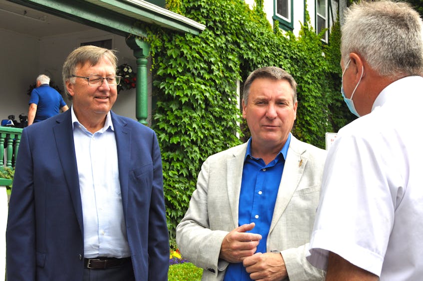 PC MHAs Tony Wakeham (left), and David Brazil, the provincial party’s interim leader, attended a campaign visit by federal Conservative Leader Erin O’Toole at the Glynmill Inn in Corner Brook on Friday, Aug. 27. The two spoke with Scott Parsons (right) of Conception Bay South outside the hotel following the event. — Diane Crocker