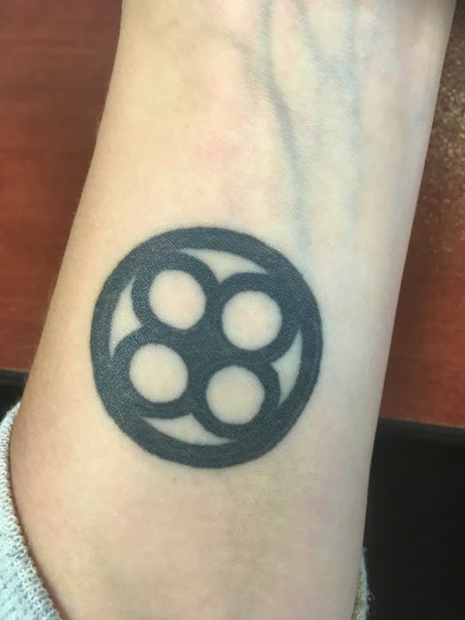 Maggie Marston-Berk had the international symbol for dyslexia — a blend of the letters “qp” and “db” — tattooed on her wrist to remind her that the learning disability can’t stop her from reaching her goals. Contributed - Christopher Connors