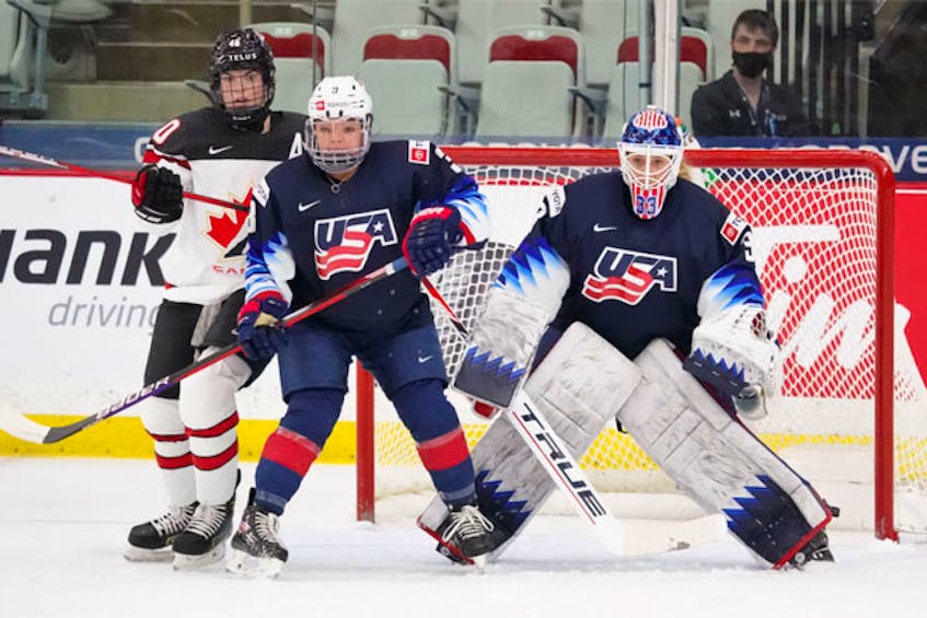 Blayre Turnbull of Stellarton watches for the puck near the U.S. goal during the Canada-U.S. preliminary round game of the IIHF women's world championship Thursday, Aug. 26, 2021 in Calgary. - IIHF