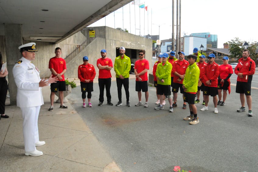  HMCS St. John’s commanding officer Cmdr. Jon Nicholson greets the 15 members of the ship’s company who completed the 2021 Run The Rock for Make-a-Wish Canada-Newfoundland and Labrador Branch at St. John’s City Hall Friday morning. — Joe Gibbons/The Telegram