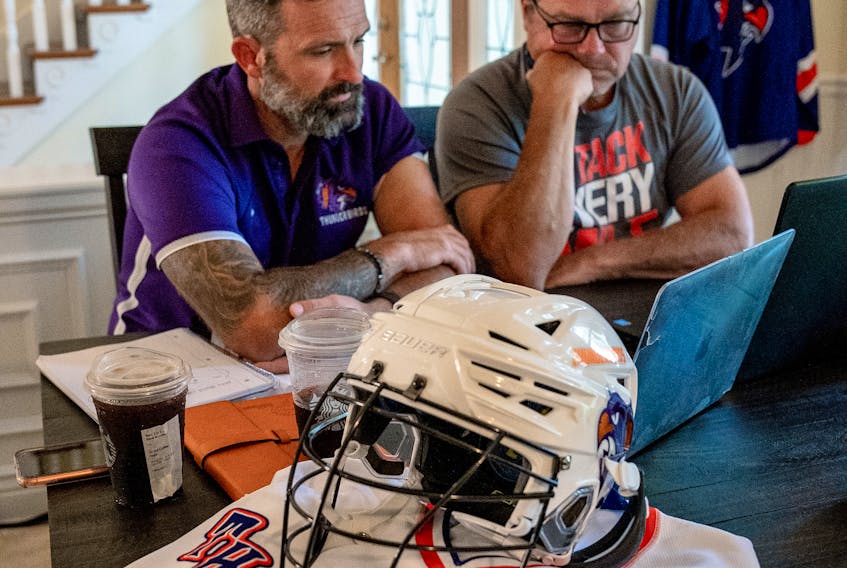 Halifax Thunderbirds head coach Mike Accursi, left, and Jamie Batley follow the National Lacrosse League's Entry Draft on Saturday night. The Thunderbirds drafted remotely from owner Curt Styres' home in Jacksonville, Fla. - Contributed