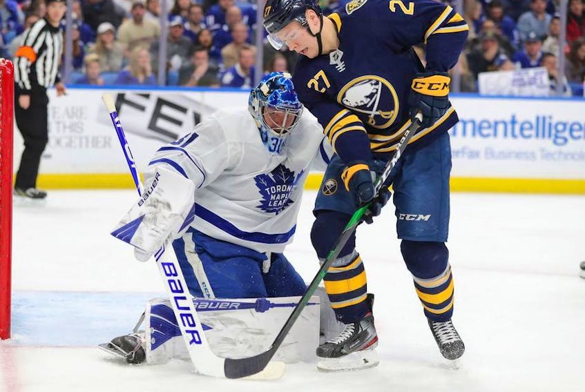 Toronto Maple Leafs goaltender Frederik Andersen (31) looks to make a save on Buffalo Sabres center Curtis Lazar (27) during the second period at KeyBank Center. 