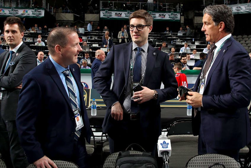 (L-R) John Lilley, Kyle Dubas and Brendan Shanahan of the Toronto Maple Leafs. Lilly is leaving the Leafs to take a job with the Rangers. 
