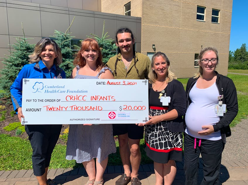 (From left) Janet Murphy of the Sandra Schmirler Foundation and her children and former Kool Aid Kids Jestyn and Hale Murphy present a $20,000 contribution to Cumberland Regional Health Care Centre women’s and children’s health programs manager Tanya LeBlanc-Earle and maternity-child-care nurse Erin Dowe for a neonatal warming/resusitaire unit for the hospital. - Darrell Cole
