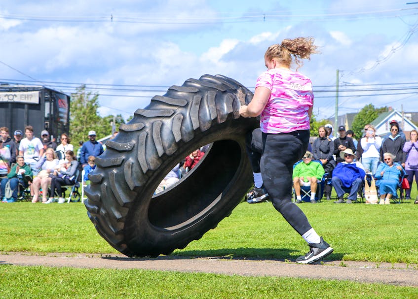Elizabeth Burt is focused during the tire flip event of the fourth annual P.E.I. Strongwoman Competition in Summerside on July 31. - Lowell Palmer • Special to The Guardian