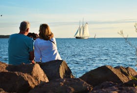 Jay and Lynda Willyard watch from Summerside’s shoreline as the Bluenose II silently sails past Indian Head Lighthouse. The famous ship arrived on the evening of Aug. 29 and was scheduled to depart for Charlottetown the following day. Bluenose II is sailing around the Maritimes to celebrate its namesake's 100th anniversary. 