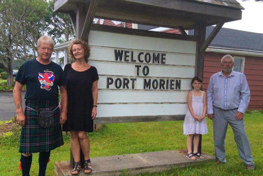 New residents in Port Morien are embracing the Cape Breton lifestyle. Jim Heron and Mona Kirkwood, left, operate the Old Rectory Bed and Breakfast while Ray Whiffen lives on a property at the entrance to the village that is referred to as the Mine Manager’s House with his wife Darlene and granddaughter, Ava. Contributed